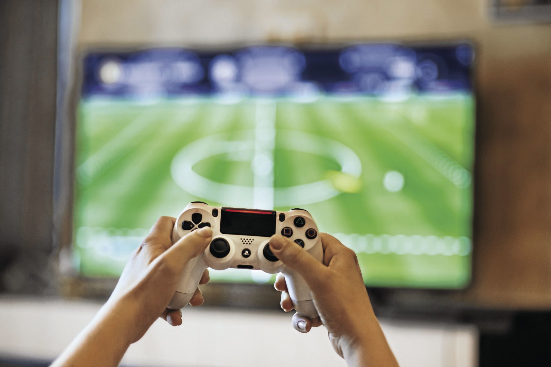 person-holding-game-pads-1174746_CMYK.jpg